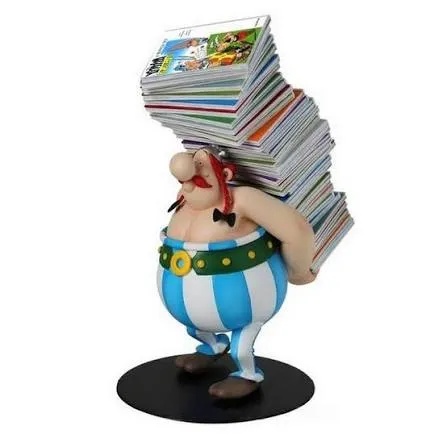 ASTERIX EN OBELIX - BEELDJE OBELIX MET EEN STAPEL ASTERIX-ALBUMS